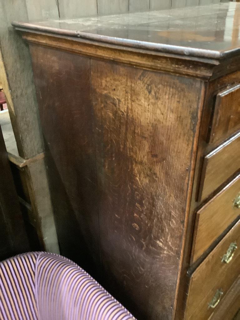 An 18th century oak chest on stand, width 100cm, depth 54cm, height 140cm